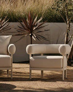 Load image into Gallery viewer, Rocchetto lounge chair taupe boucle — oceanside terrace view — cylindrical back detail — Minosé