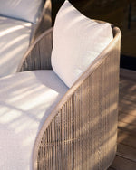 Load image into Gallery viewer, Detail shot of Corda chair arm — woven rope wrap and linen cushion junction — Minosé
