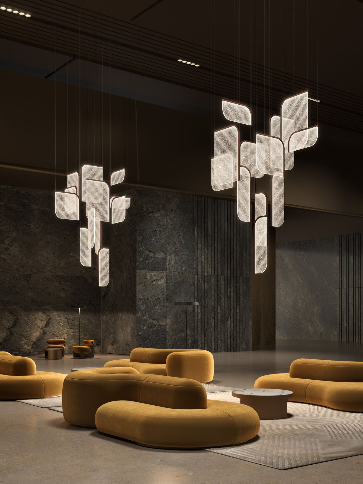 Foglia modular pendant lights — clustered arrangement in light finish — suspended in interior space with golden seating — minosé
