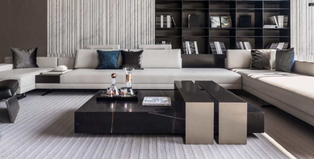 Luxury black marble center table with bronze sculptural accents by Minosé