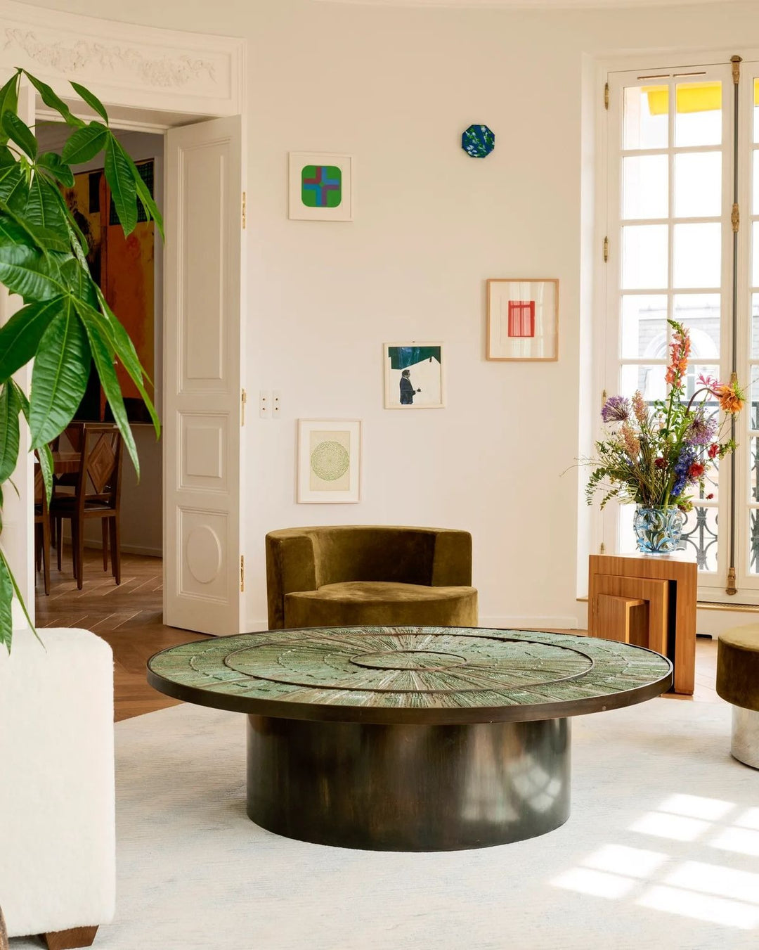 Luxury sculptural round center table with textured green artistic tabletop by Minosé