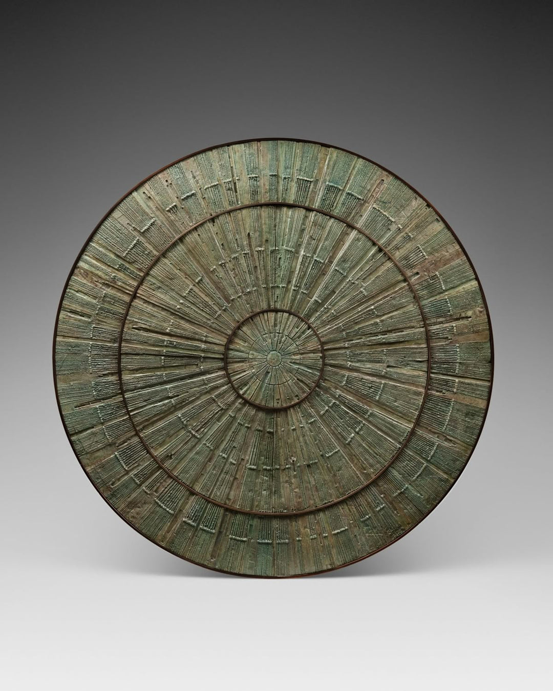 Luxury sculptural round center table with textured green artistic tabletop by Minosé